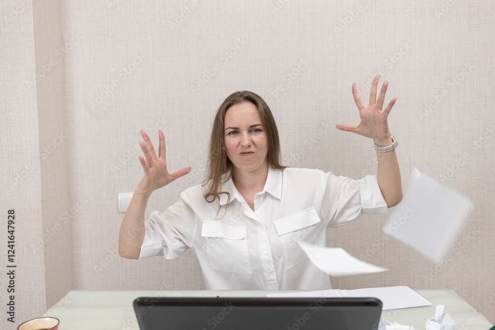 Female person office worker or freelancer works in office or at home at computer. Woman gets angry and throws paper in different directions, she does not succeed in her work, she was tired of working. Female person office worker or freelancer works in office or at home at computer. Woman gets angry and throws paper in different directions, she does not succeed in her work, she was tired of working.
