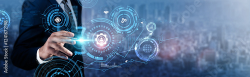 Fotografie Change Management: Businessman analyzing technological data and process optimization, team alignment, organizational development, leadership strategies, and transformation initiatives