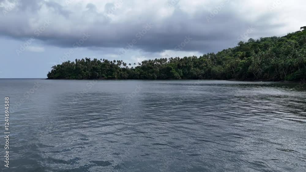 Sao Tome and Principe - Aerial View of Palm-Covered Peninsula. Lush Tropical Landscape Surrounded by Pristine Ocean Waters. Sao Tome and Principe - Aerial View of Palm-Covered Peninsula. Lush Tropical Landscape Surrounded by Pristine Ocean Waters.