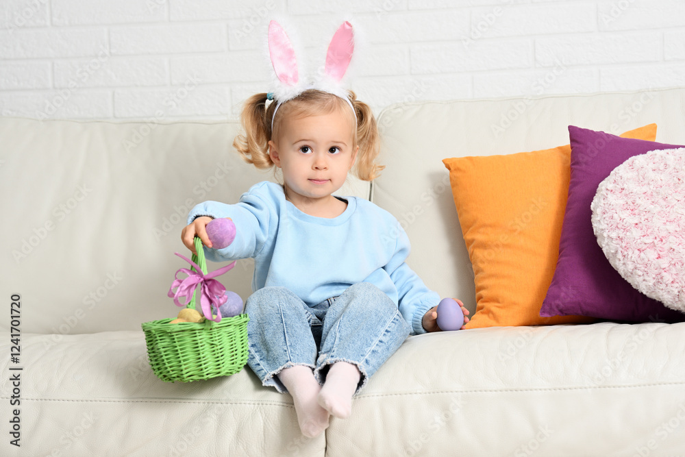 Little girl in bunny ears with Easter eggs Little girl in bunny ears with Easter eggs