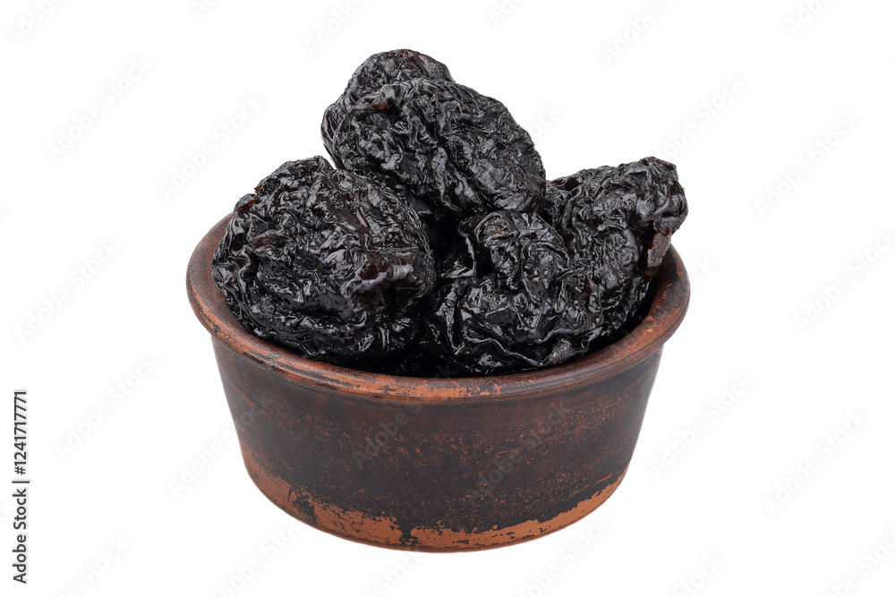 Prunes in a clay bowl isolated on white background. Prunes in a clay bowl isolated on white background.
