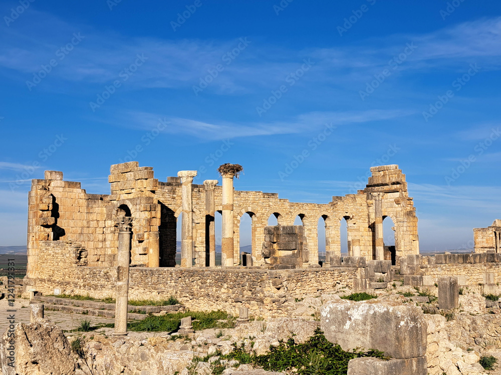 Exploring Ancient Ruins Under a Clear Blue Sky in a Historic Landscape Exploring Ancient Ruins Under a Clear Blue Sky in a Historic Landscape