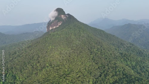 Sao Tome and Principe - Aerial View of Pico Maria Fernandes. Majestic Volcanic Mountain Rising Above Dense Tropical Rainforest Near Angolares. photo