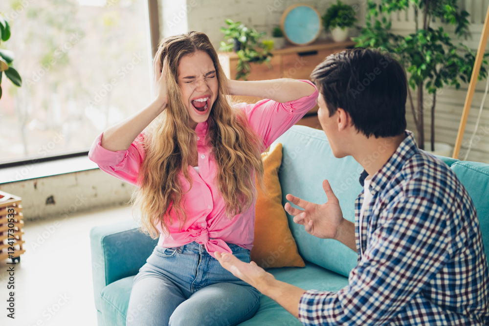Two friends having a lively discussion indoors in a stylish living room Two friends having a lively discussion indoors in a stylish living room