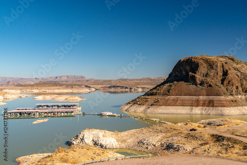 Fototapeta Naklejka Na Ścianę i Meble -  USA, New Mexico, Elephant Butte State Park. Elephant Butte and lake marina with low water level.