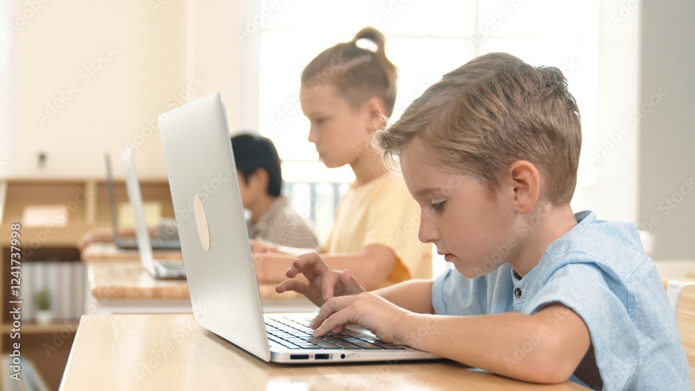 Caucasian smart child programing software system and learning about coding while multicultural searching about engineering code. Happy boy thinking about engineering prompt by using laptop. Pedagogy. Caucasian smart child programing software system and learning about coding while multicultural searching about engineering code. Happy boy thinking about engineering prompt by using laptop. Pedagogy.