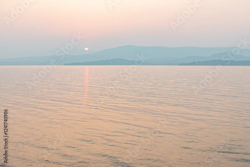 USA, Montana, Flathead Lake. Sunset during wildfire smoke.