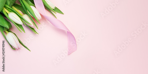 Bouquet of fresh cut pink tulips on a pink background with ribbon. Spring Festival.