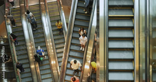 Escalator in busy mall from above
