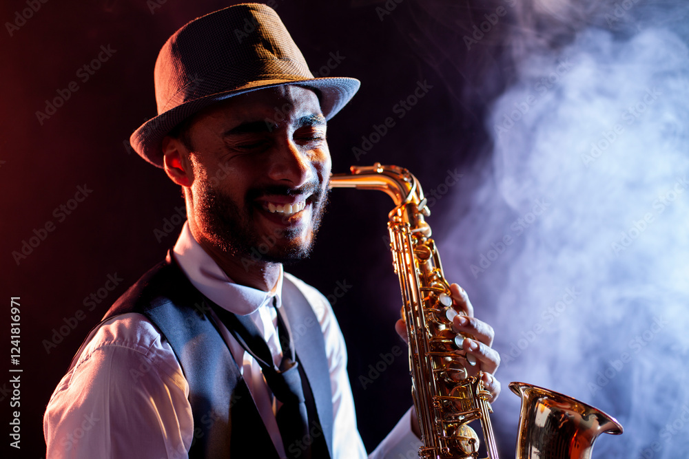 Naklejka premium Smiling saxophonist with hat and smoke on background
