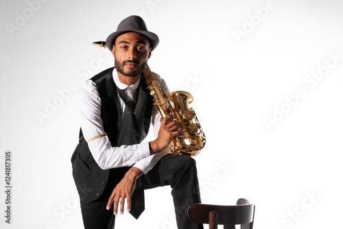 Saxophonist with hat on white background photo