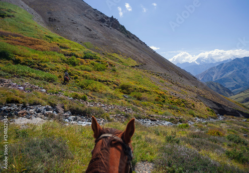 Mountain hunters travel on horseback to the ibex hunting site.