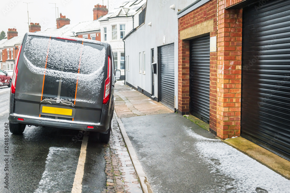 Obraz premium Frost snow covered british road and cars in england uk