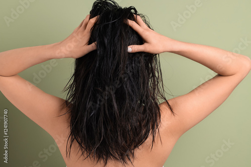 Young woman with wet hair o...