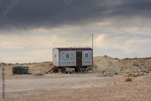 Abandoned trailer in the desert of the Aral Sea, uzbekistan photo