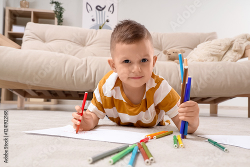Happy little boy drawing wi...