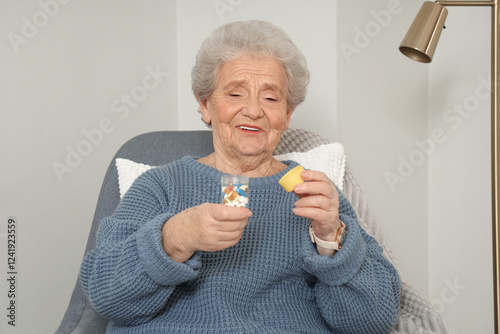Senior woman with pill bott...