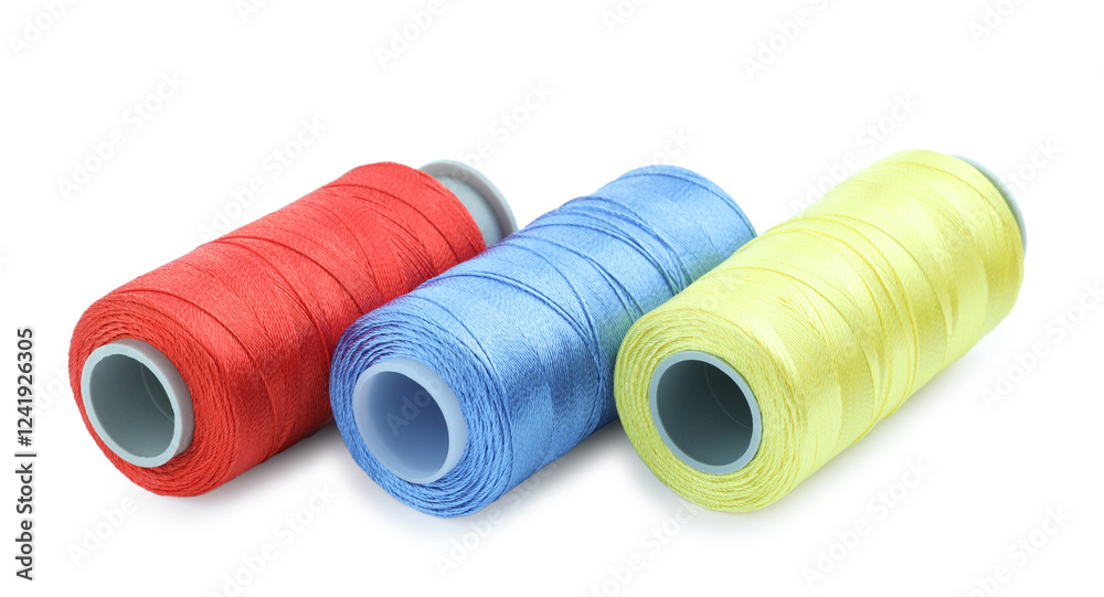 Spools of bright sewing threads isolated on white Spools of bright sewing threads isolated on white
