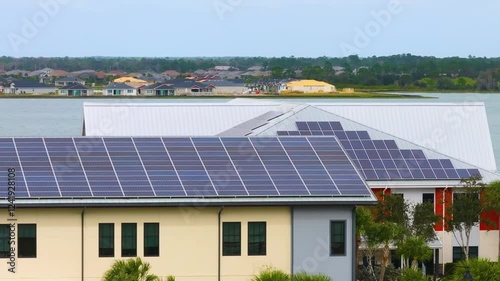 Wallpaper Mural Florida office building with solar roof. Blue photovoltaic panels for producing clean ecological electric energy. Investing in renewable electricity concept Torontodigital.ca