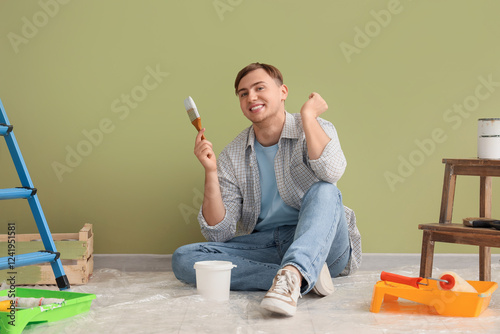 Young man with paint brush ...