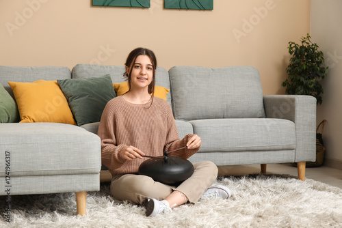 Young woman playing glucoph...