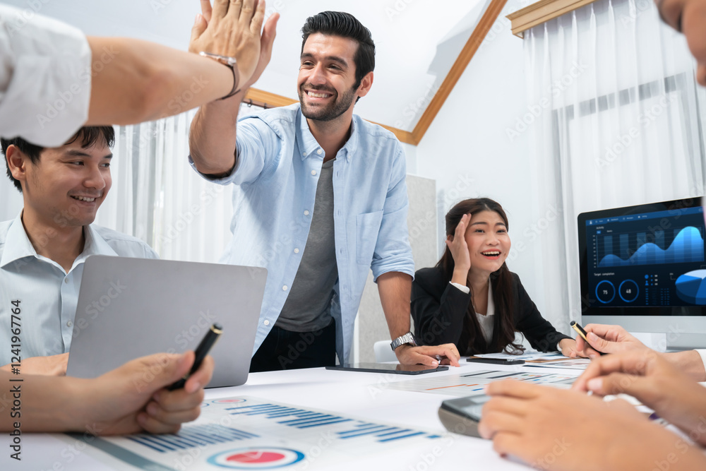 Analyst team leader celebrate and high five together with his colleague after successful data analysis meeting using FIntech software power with business intelligence or BI dashboard. Prudent Analyst team leader celebrate and high five together with his colleague after successful data analysis meeting using FIntech software power with business intelligence or BI dashboard. Prudent