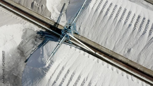 Aerial view of a sea salt production area, on the coast of Santapola, Spain. photo