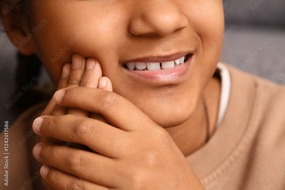 Cute African-American girl suffering from tooth ache at home, closeup Cute African-American girl suffering from tooth ache at home, closeup