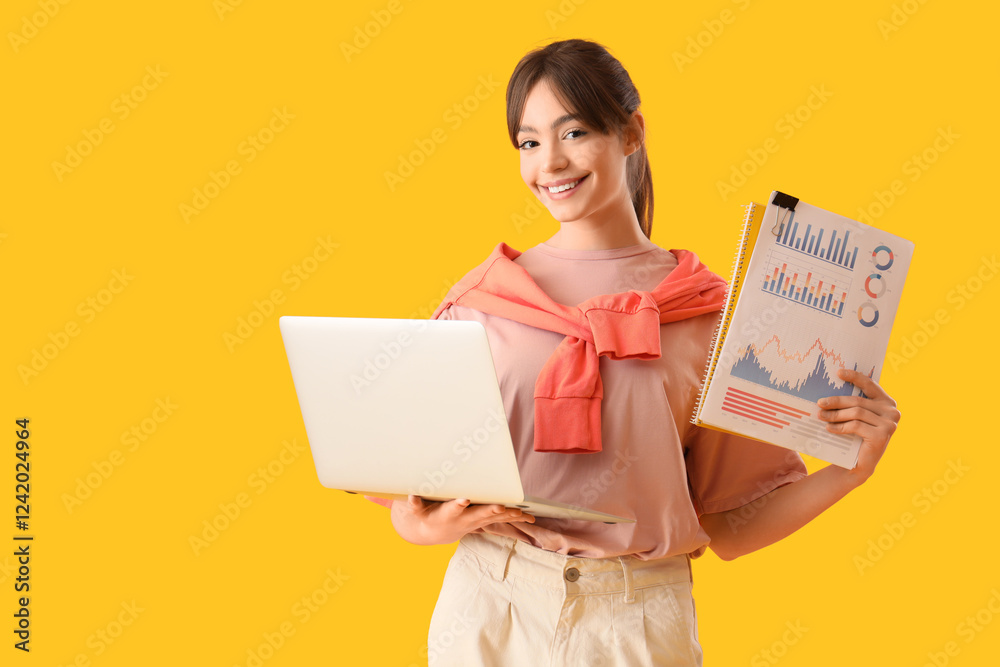 Teenage girl with laptop and diagrams working online on yellow background Teenage girl with laptop and diagrams working online on yellow background