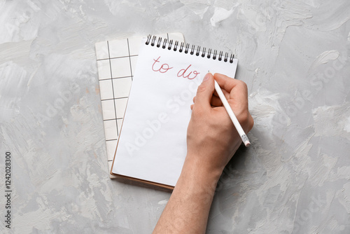 Male hand with to-do list a...