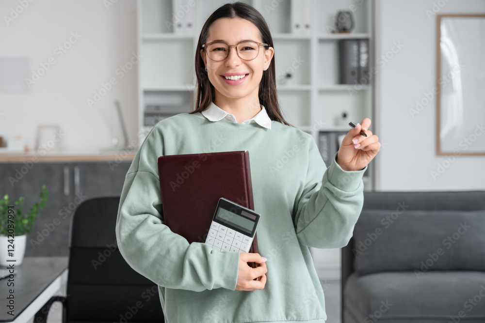 Young businesswoman with report and calculator in office Young businesswoman with report and calculator in office