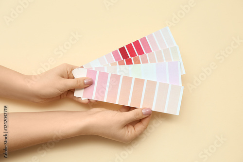 Hands holding color swatch ...