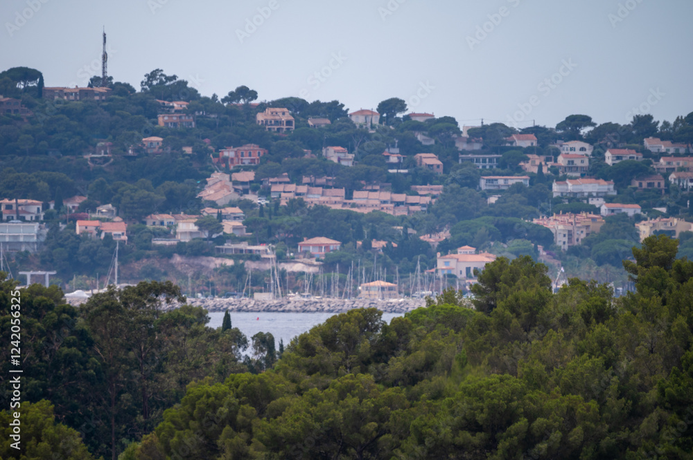 Obraz premium Landscape of French Riviera, view on hills, houses and green vineyards Cotes de Provence, production of rose wine near Saint-Tropez and Pampelonne beach, Var, France