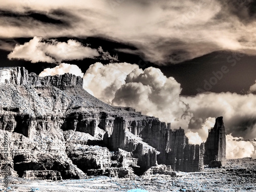 USA, Utah. Infrared of Fisher Towers with large clouds photo