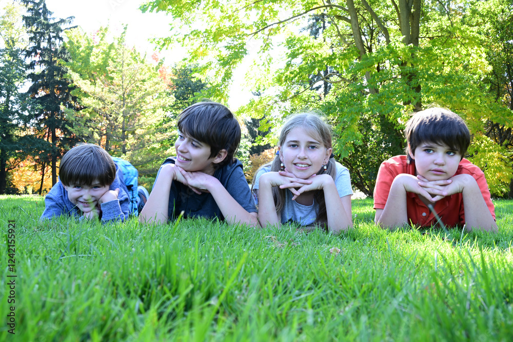 Fototapeta premium children lying in the grass