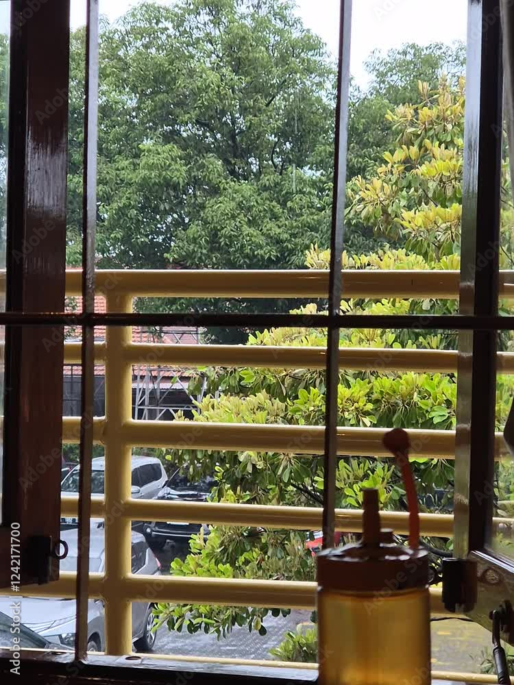 Wooden window in a restaurant with a view of the nature.