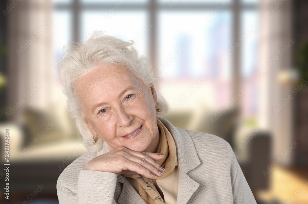 Head shot of happy old woman posing at home Head shot of happy old woman posing at home