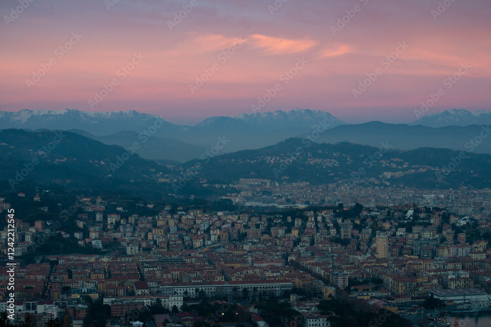 Twilight View of an Italian City with Mountain Silhouette Twilight View of an Italian City with Mountain Silhouette