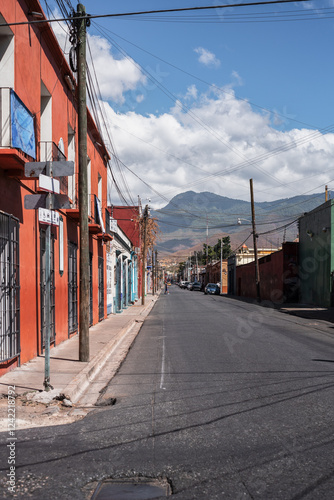 Streets of Oaxaca, Mexico with mountain range photo