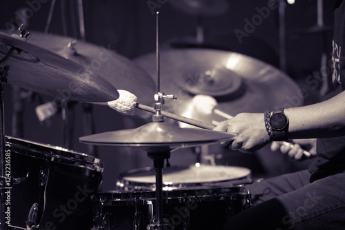 Canvas Print Drummer playing jazz with mallets, focus on cymbals and snare.