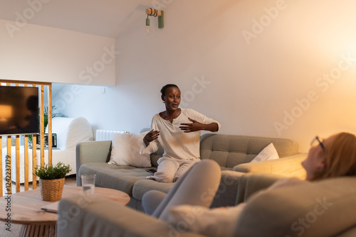 Happy expressive woman talking to her bestie photo