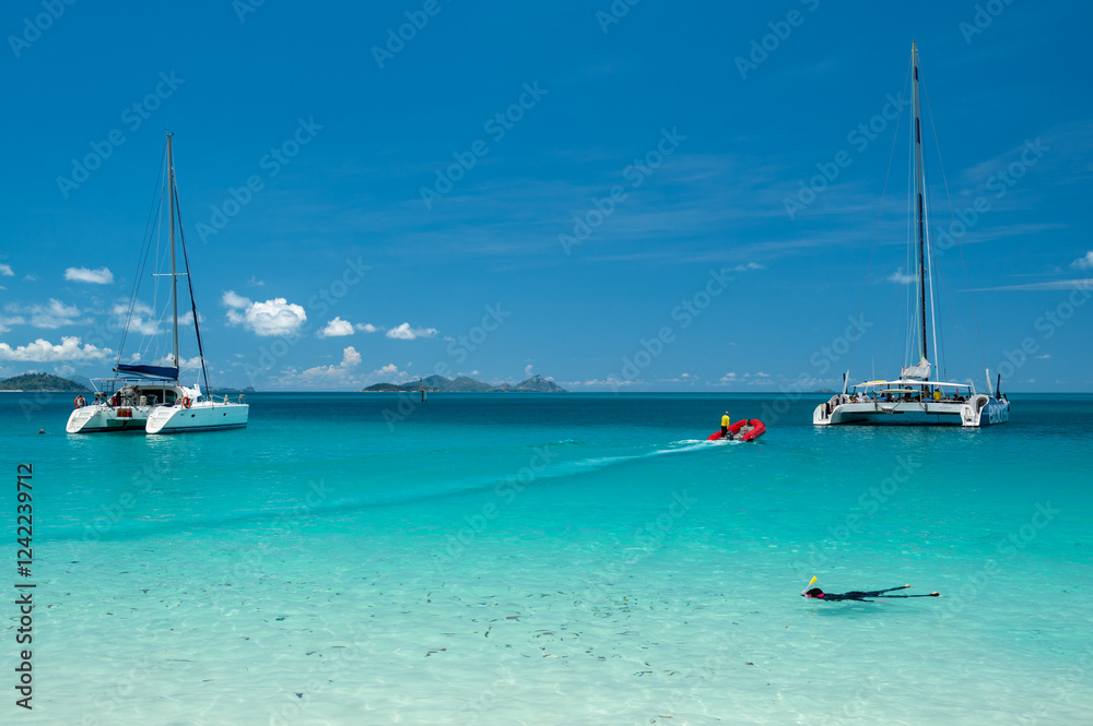 Yachts at Whitehaven Beach in the Whitsundays Yachts at Whitehaven Beach in the Whitsundays