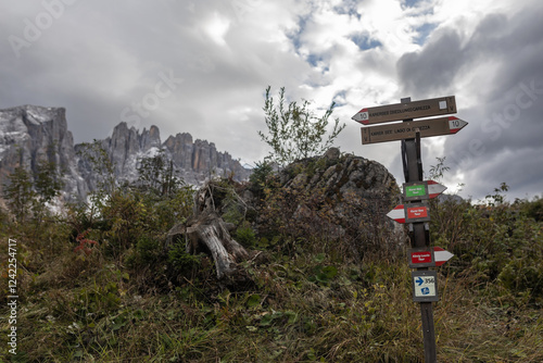 sign with direction to lake carezza in dolomites photo