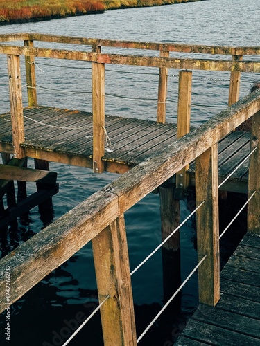 Wooden Pier Over Calm Water photo