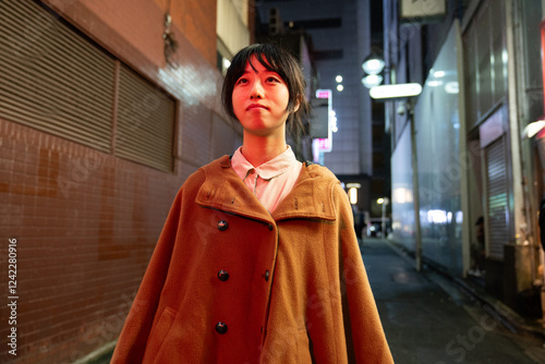 Woman walking outdoors at night photo