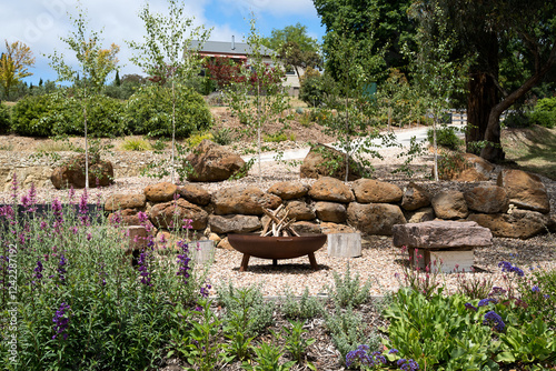 Cozy outdoor gathering space surrounded by lush green scenery photo