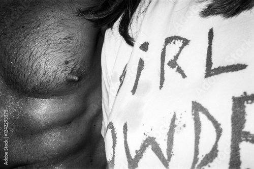 Close-Up of Man's Chest and Woman's Shirt photo