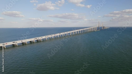 Wallpaper Mural A stunning bird's-eye view of the Sunshine Skyway Bridge stretching across the waters of St. Petersburg, Florida, on a clear, sunny day. Torontodigital.ca