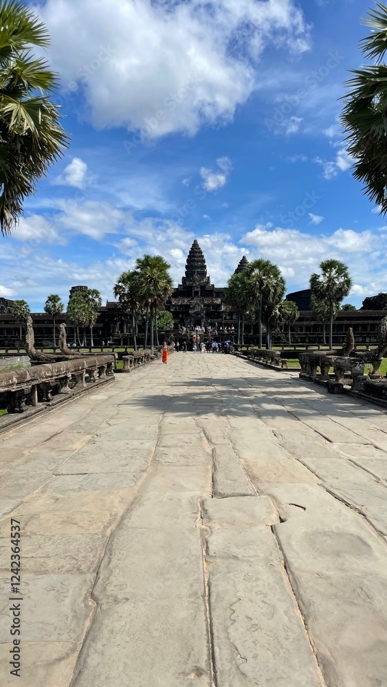 Fototapeta premium Angkor Archaeological Park, Siem Reap, Cambodia. Stone road leading to the historical complex of Angkor Wat