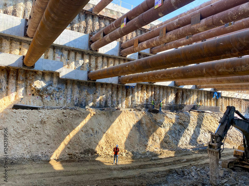 Excavators digging at the construction site photo